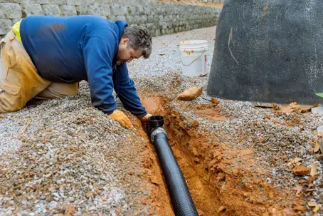 man checking a sewer line